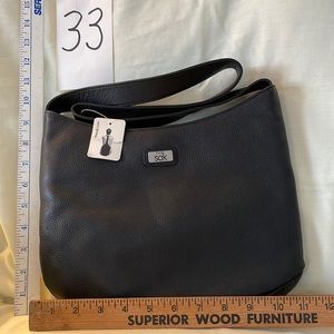 New, Never used The Sak black leather bag!